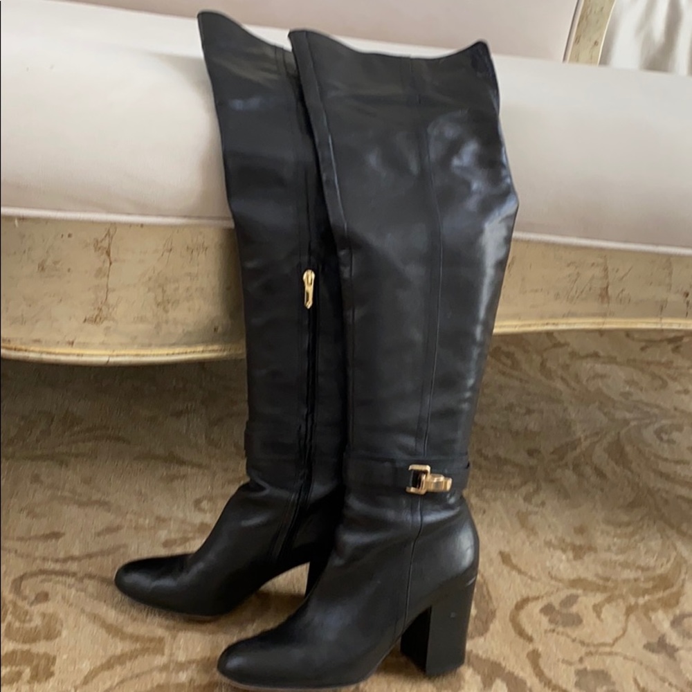 Black over the knee leather boots.